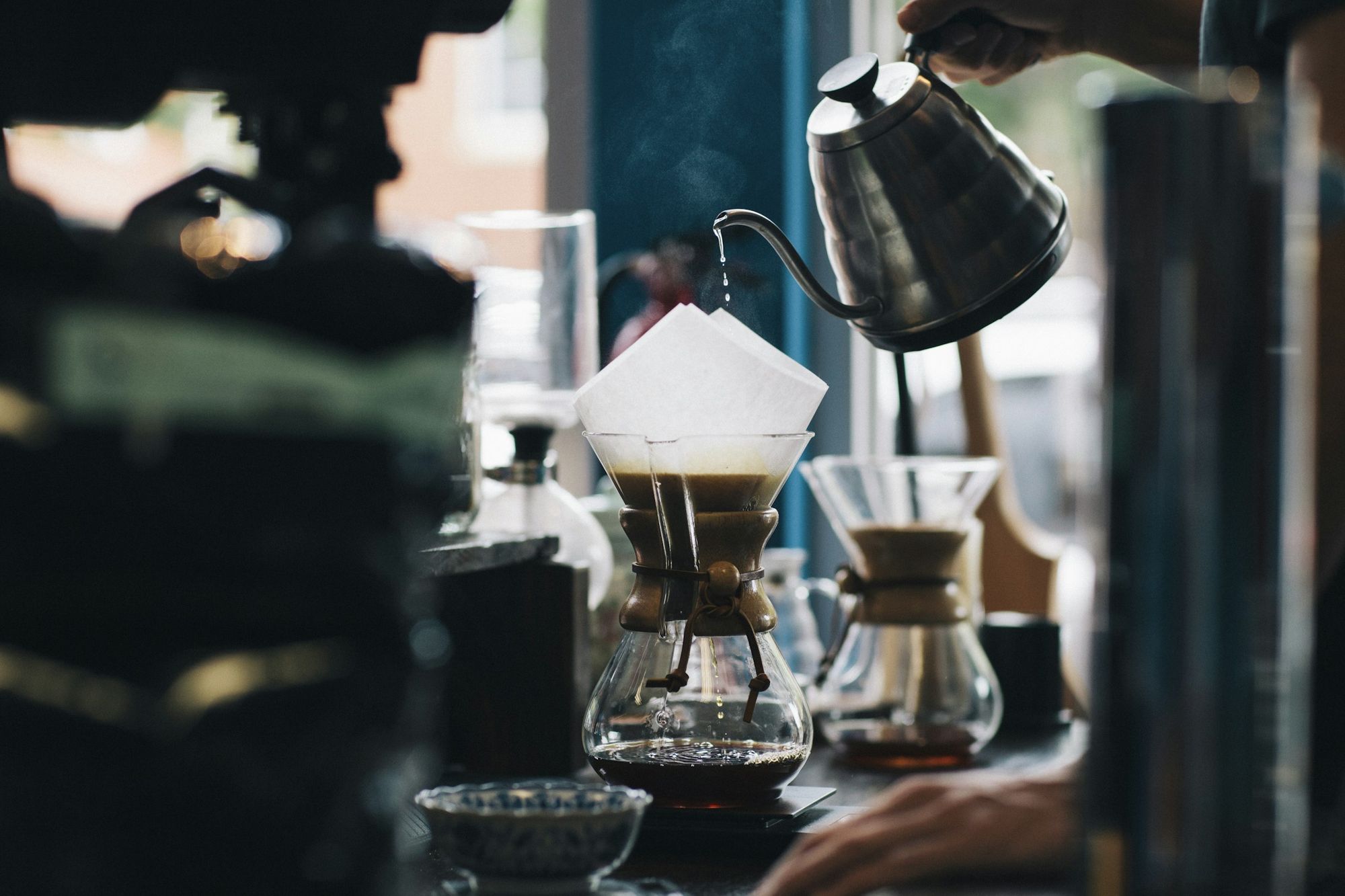 Pour-over coffee being brewed with a gooseneck kettle